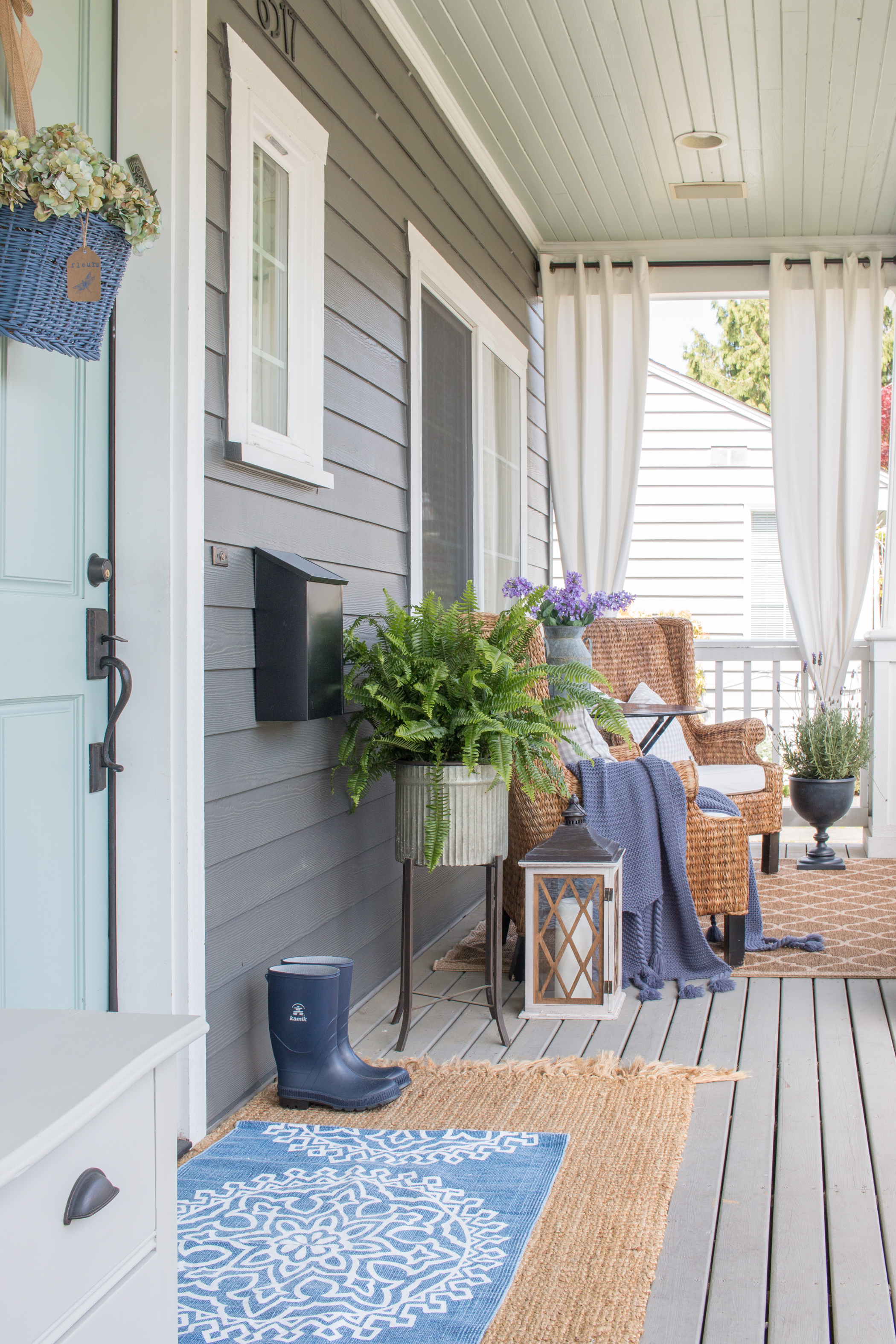 Front porch with seagrass chairs and blue front door - Saw Nail and Paint